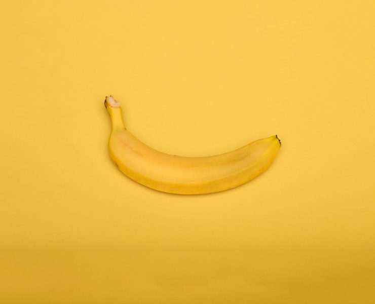 yellow banana on yellow background