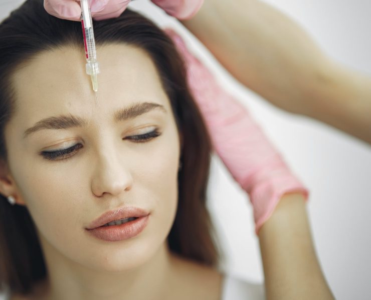 woman getting a face botox