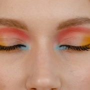 a close up shot of a person with colorful eyeshadow