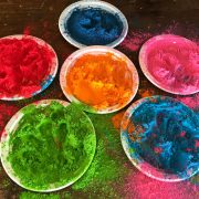 plates with colorful powder on floor
