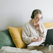 photo of woman taking notes