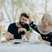 woman wearing brown hijab touching a man s hair